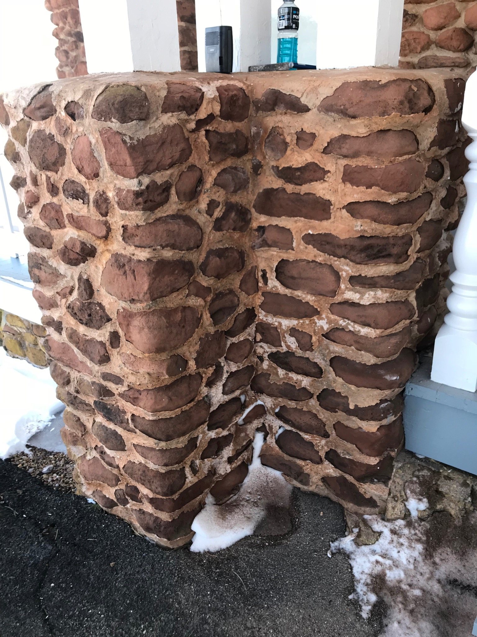 Historic sandstone pillar at Dalvay by the Sea undergoing selective repointing and restoration