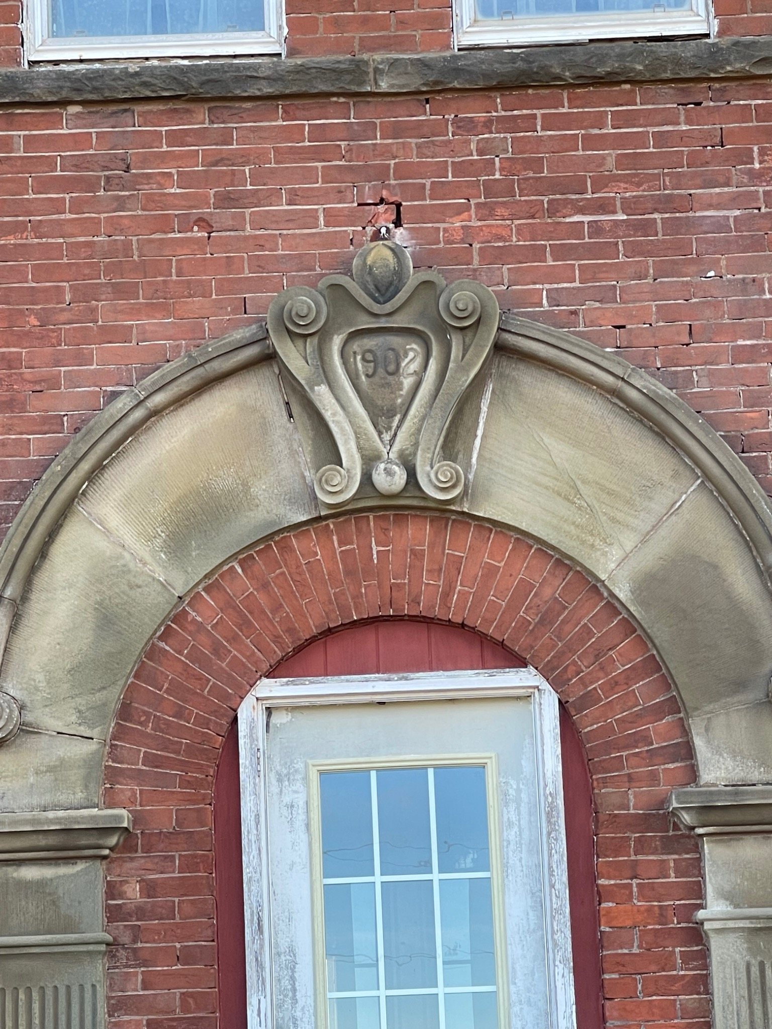Historic stone and brick entrance detail at the Mont-Carmel Parish House