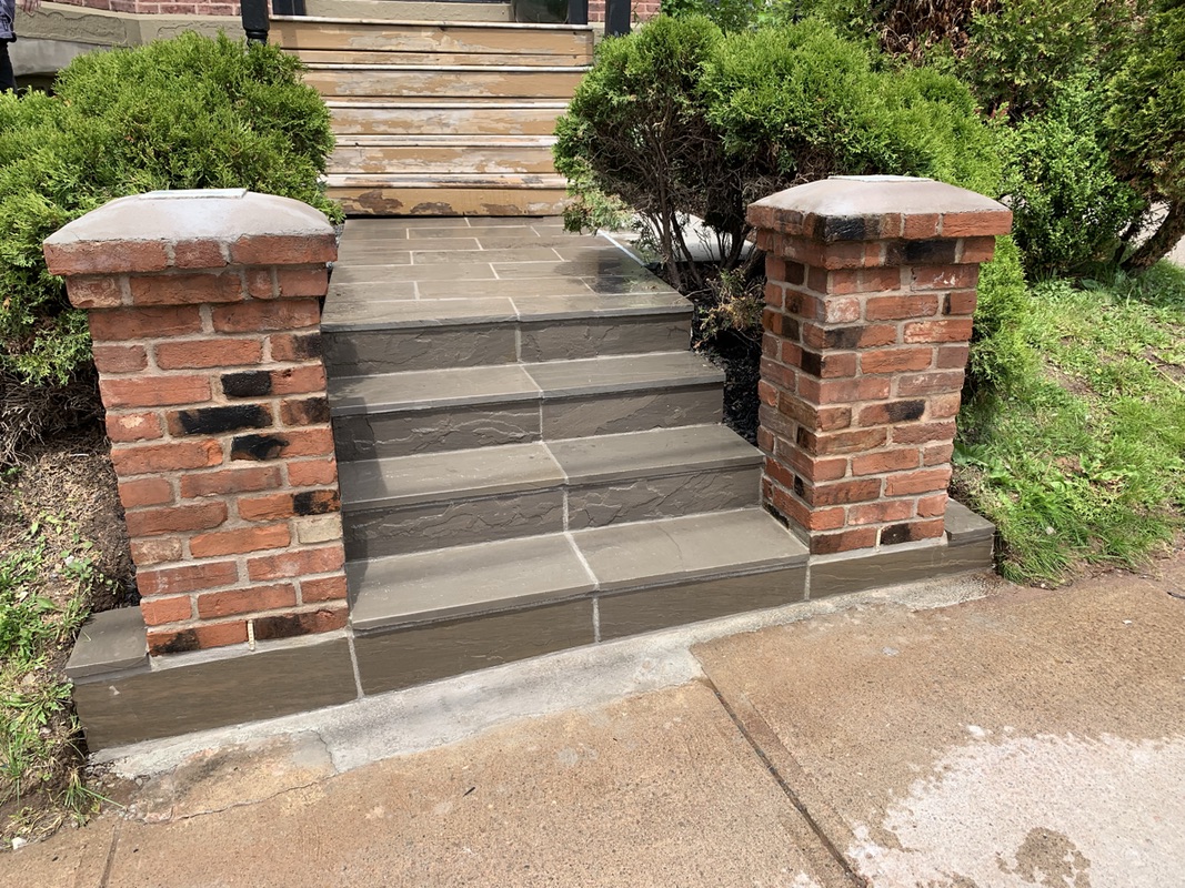 Outdoor natural stone masonry and ModuStone outdoor living features
